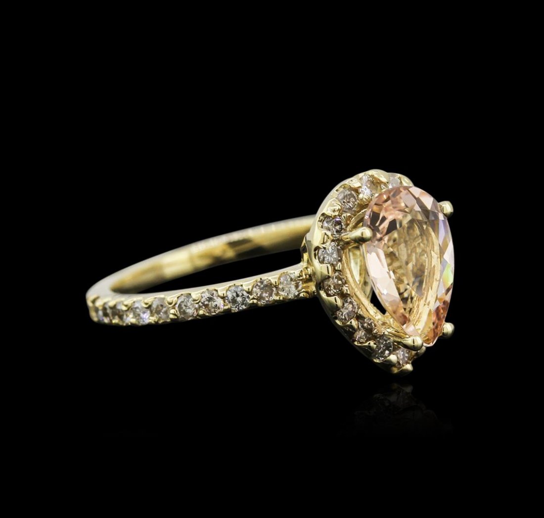 14KT Yellow Gold 1.29ct Morganite and Diamond Ring: One electronically tested 14KT yellow gold ladies cast morganite and diamond ring with a flat shank with a bright polish finish. Identified with markings of "K14". Condition is new. Containing: One pr