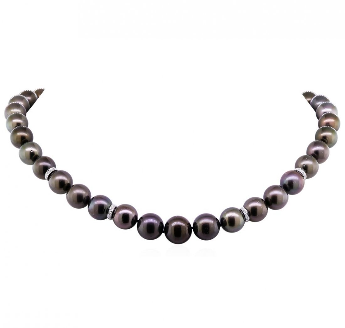 0.40ctw Tahitian Cultured Pearl and Diamond Necklace: One graduated single strand pearl necklace 17.5" princess length, knotted with a tongue clasp containing 37 Tahitian pearls, 10.1mm in size to 13.3mm in size. The pearls are black in color, green over