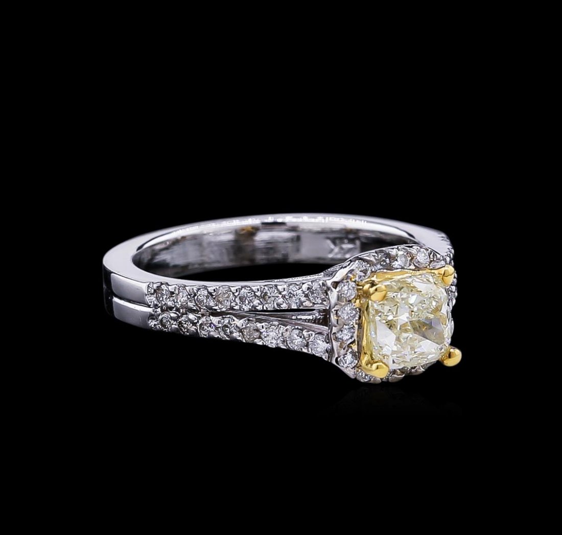 1.43ctw Fancy Light Yellow Diamond Ring - 14KT Two-Tone: One electronically tested 14KT white and yellow gold lady's combination cast & assembled wedding ring with a cathedral split shank with a bright polish finish. The featured lady's ring has a double sh
