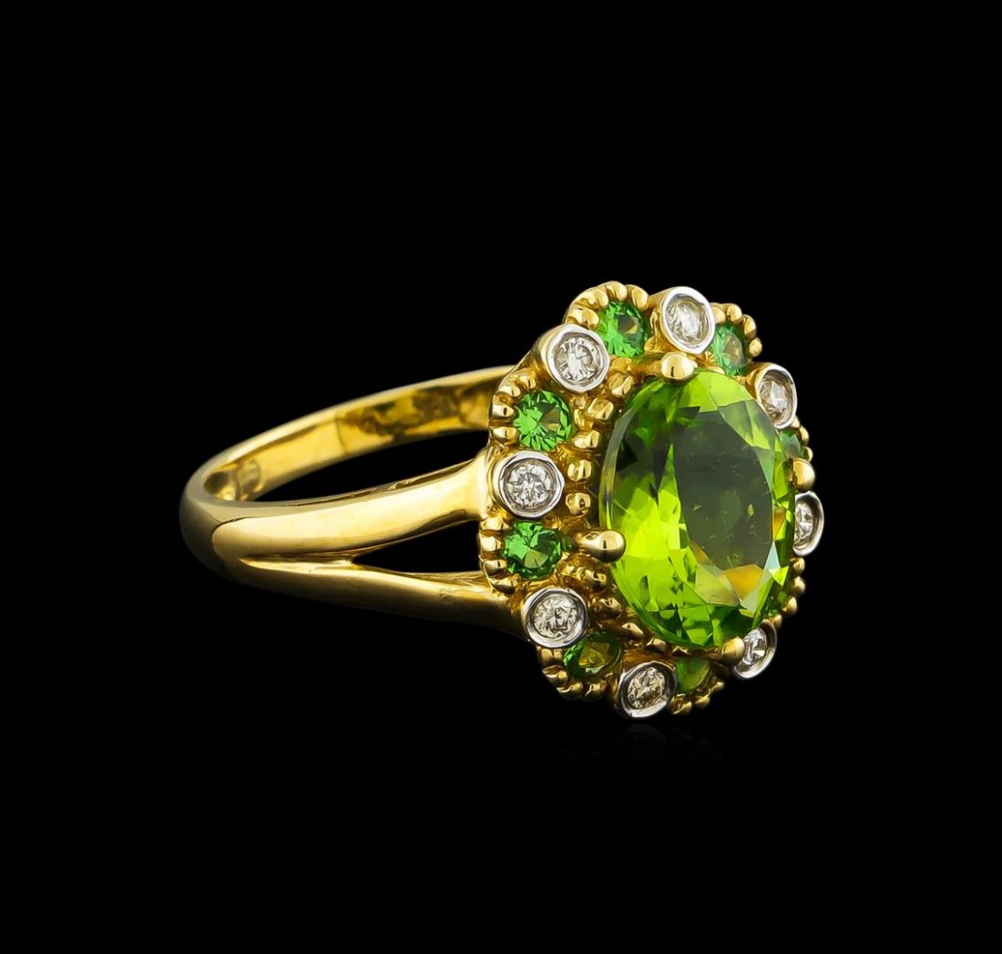 2.24ct Peridot, Tsavorite and Diamond Ring - 10KT: One ring featuring: 10KT yellow gold weighing 2.48 grams containing one peridot center stone with a total weight of 2.24ct, eight tsavorite side stones with a total weight of 0.33ct, and 8 round diamo