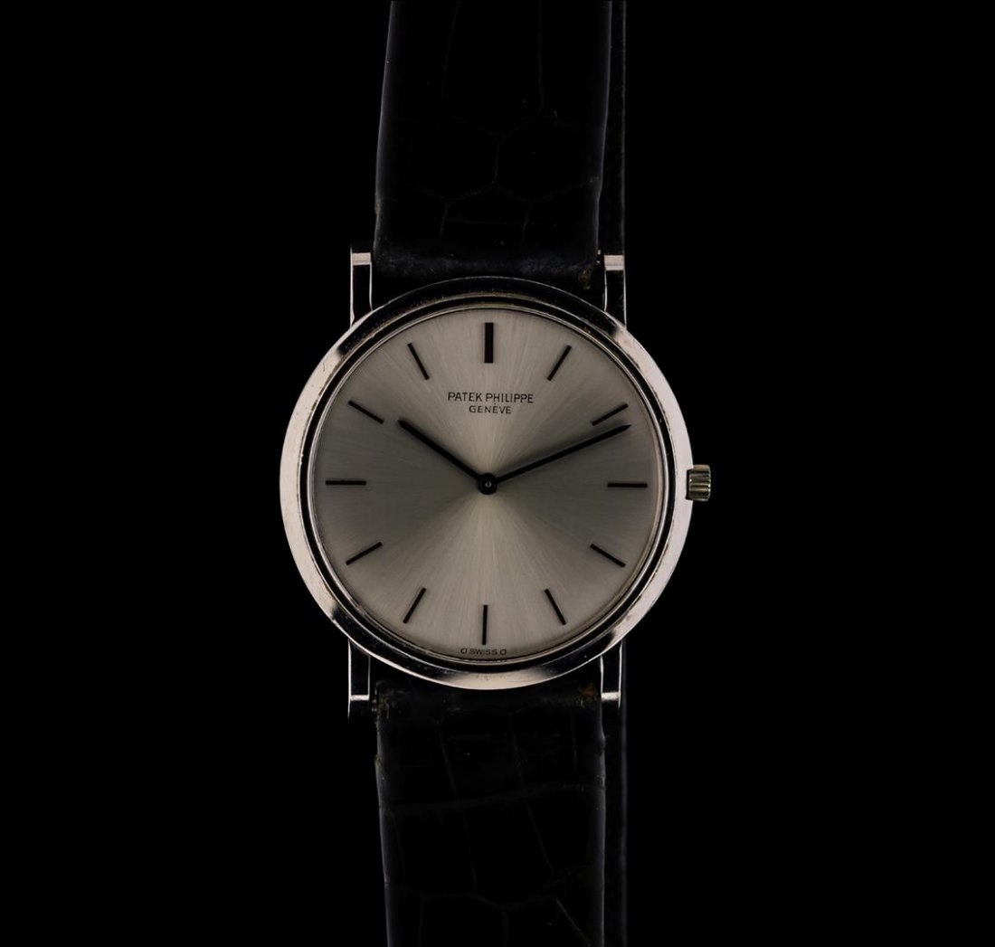 Patek Philippe 18KT White Gold Calatrava Men's Watch: One gents, Patek Philippe wristwatch electronically tested 18KT White gold, Swiss Hallmarked Case: 32mm diameter, Water Resistant: 25 meters / 82 feet, Crown: scalloped with logo, Bezel: polished, Cry