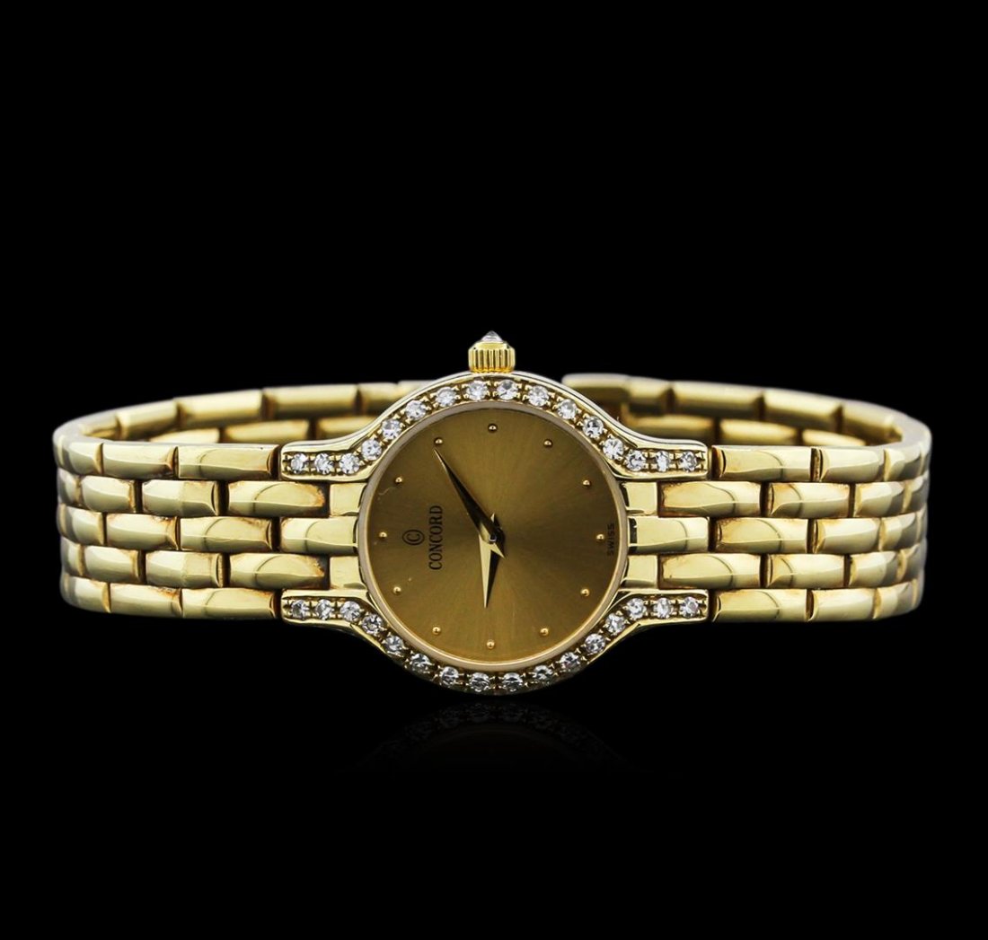 Concord 14KT Yellow Gold Diamond Ladies Watch: One Concord ladies wristwatch featuring: Case: 14KT yellow gold. Bezel: 14KT yellow gold diamond set. Dial: Gold tone with gold tone hour and minute hands. Bracelet/buckle: 14KT yellow gold. Total wei