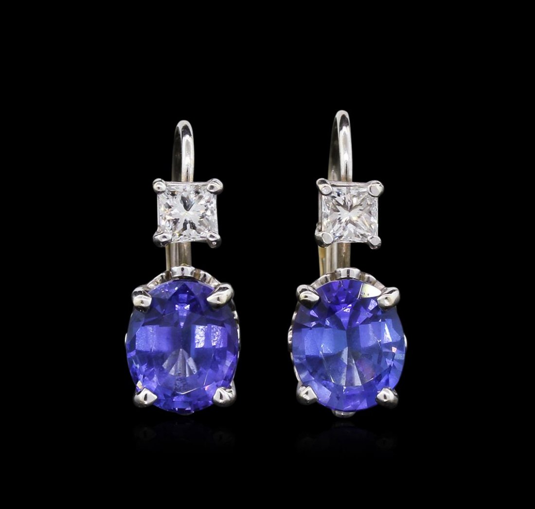 4.14 ctw Tanzanite and Diamond Earrings - 14KT White: One electronically tested 14KT white gold ladies cast & assembled tanzanite and diamond dangle earrings with lever backs. Condition is good. Bright polish finish. Identified with markings of "14K". Co