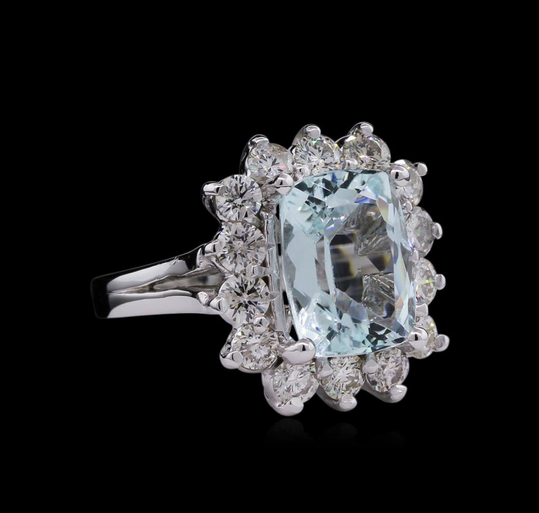 14KT White Gold 3.96 ctw Aquamarine and Diamond Ring: One electronically tested 14KT white gold ladies cast aquamarine and diamond ring with a bright polish finish. Condition is new, good workmanship. The featured aquamarine is set within a diamond bezel