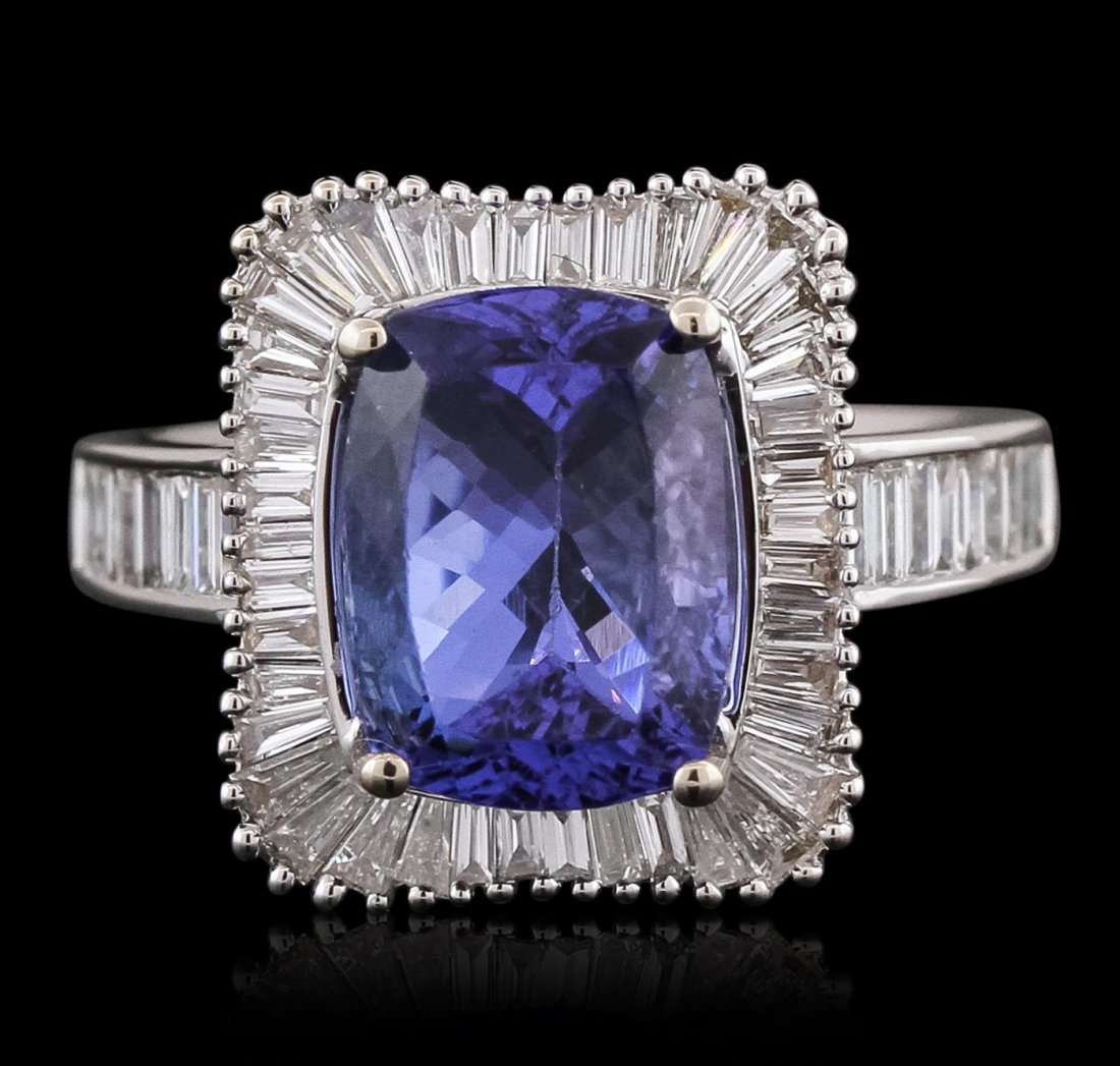 18KT White Gold 4.13 ctw Tanzanite and Diamond Ring: One electronically tested 18KT white gold ladies combination cast & assembled prong set ring with a flat shank with a bright polish finish. Identified with markings of "750". Condition is new. Contain