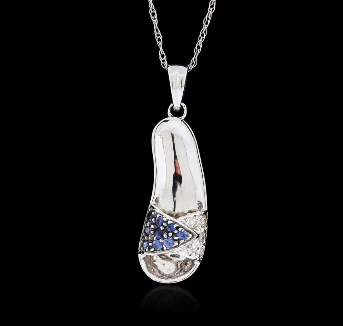 14KT White Gold 0.10 ctw Sapphire and Diamond Pendant: One sandal pendant with chain featuring: 14KT white gold weighing 3.10 grams containing blue sapphires with a total weight of 0.10ct and diamonds with a total weight of 0.05ct.