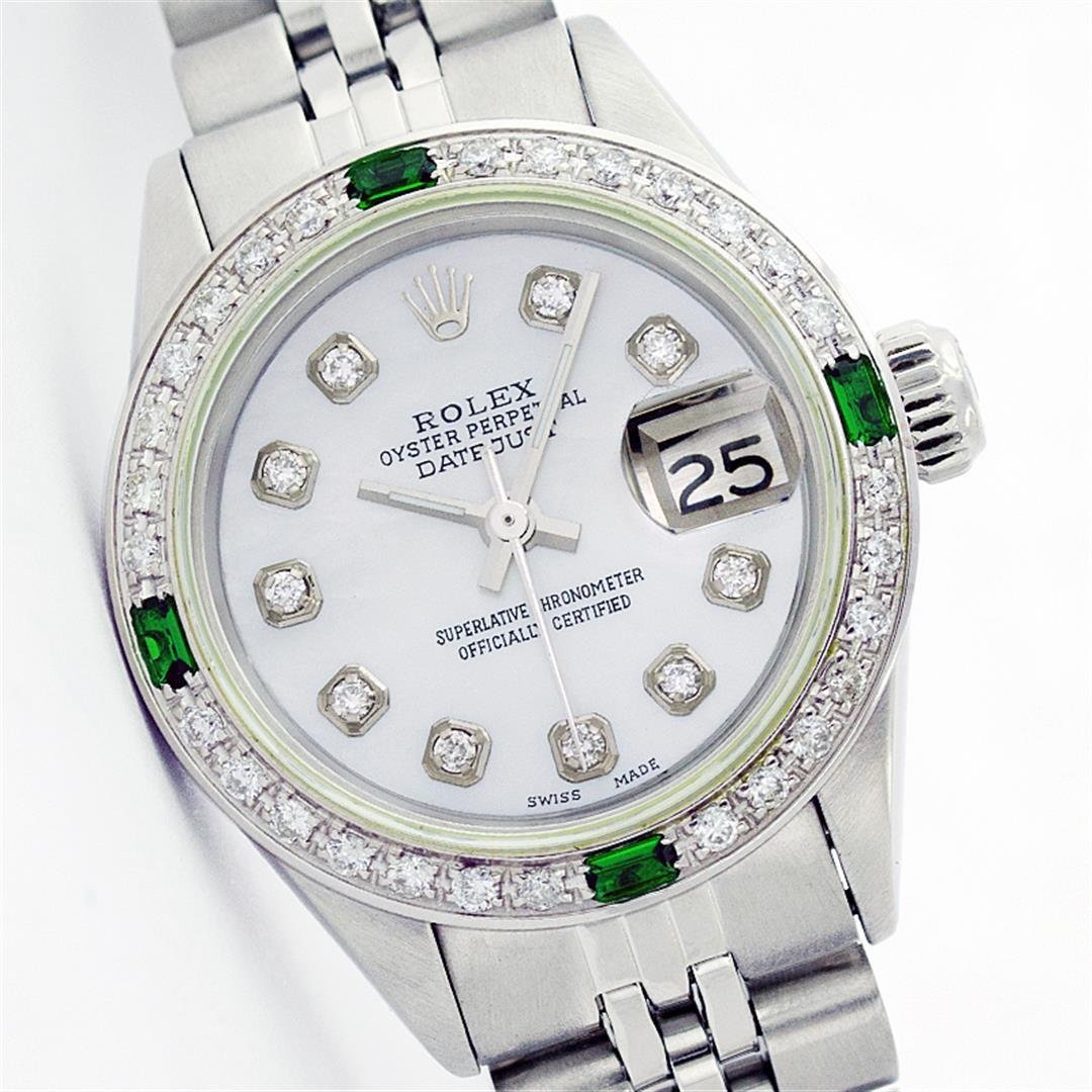 Rolex Stainless Steel Diamond and Emerald DateJust: One Ladies Rolex Datejust Polished Bright with Satin Finish, Serviced & Electronically Tested, Stainless Steel Case:26mm, Stainless Steel Crown, Custom Bezel: 18K White Gold Emerald Beadset Diamond Be