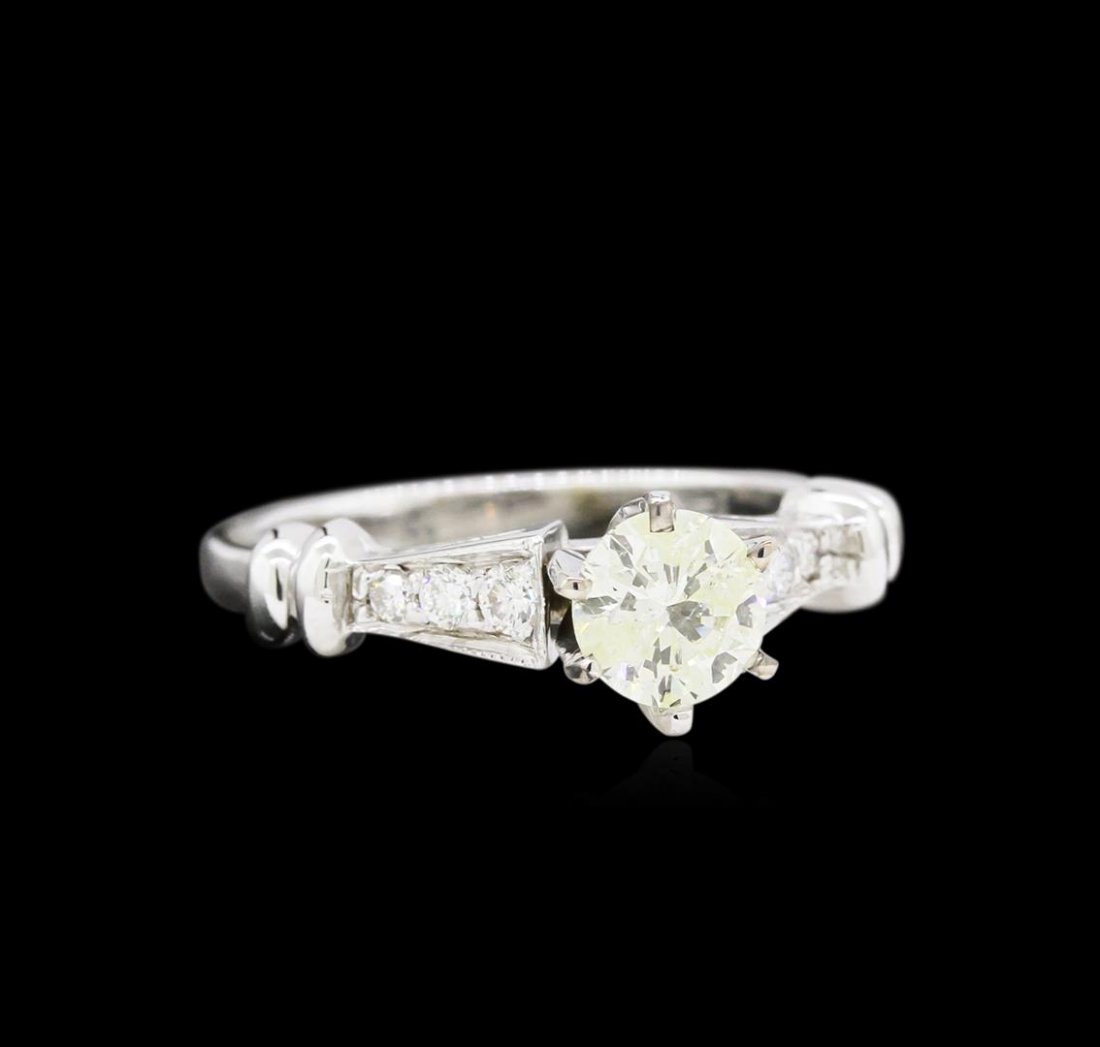 14KT White Gold 0.81 ctw Diamond Ring: One electronically tested 14KT white gold ladies cast diamond engagement ring with a bright polish finish. Identified with markings of "14K". Condition is new. Containing: One prong set round brillian