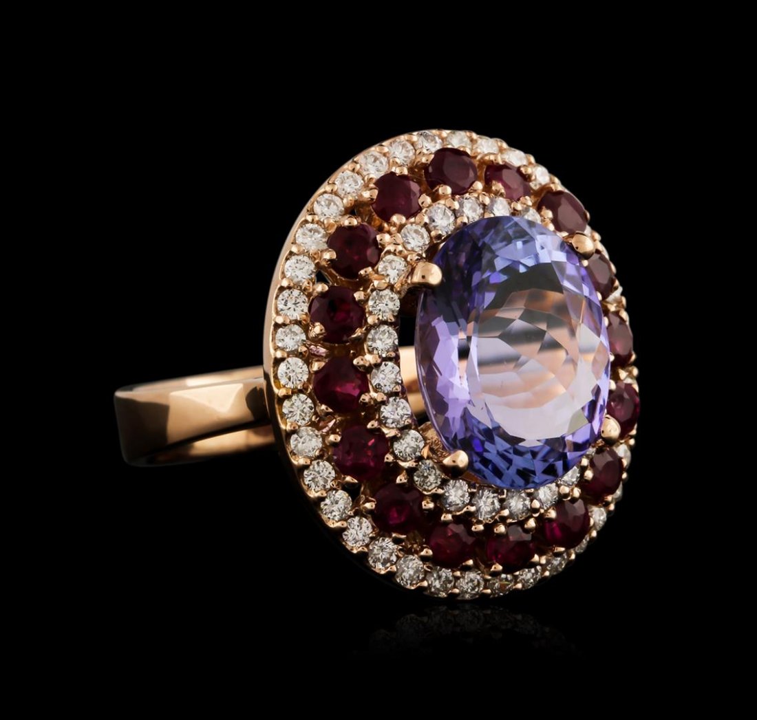 14KT Rose Gold 6.61 ctw Tanzanite, Ruby and Diamond: One electronically tested 14KT rose gold ladies cast tanzanite, ruby and diamond ring with a bright polish finish. Identified with markings of "14K". Condition is new. Containing: One prong set oval m