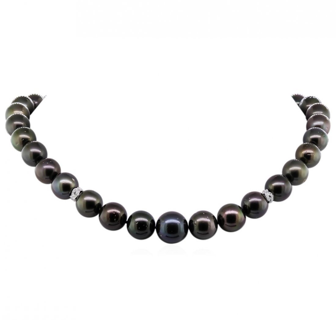 Tahitian Cultured Pearl and Diamond Necklace: One graduated single strand pearl necklace 18.5" princess length, knotted with a tongue clasp & foldover safety containing 33 Tahitian pearls, 12.0mm in size to 16.0mm in size. The pearls are black in