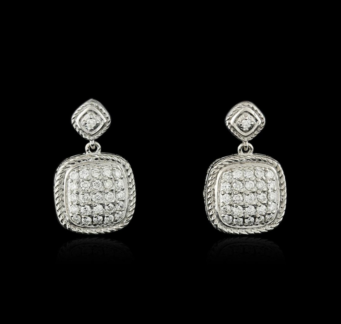 14KT White Gold 0.73 ctw Diamond Earrings: One pair electronically tested 14KT white gold ladies cast diamond earrings with friction posts with a bright polish finish. Condition is new. Containing: Sixty-Eight prong set round brilliant cut dia