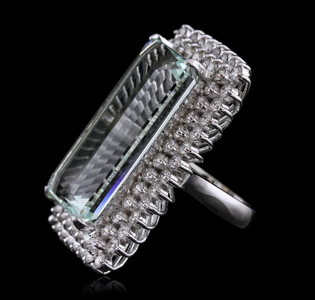 14KT White Gold GIA Certified 37.30 ctw Aquamarine and: One electronically tested 14KT white gold ladies cast aquamarine and diamond ring with a bright polish finish. Condition is new, good workmanship. The featured aquamarine is set within two tiered diam
