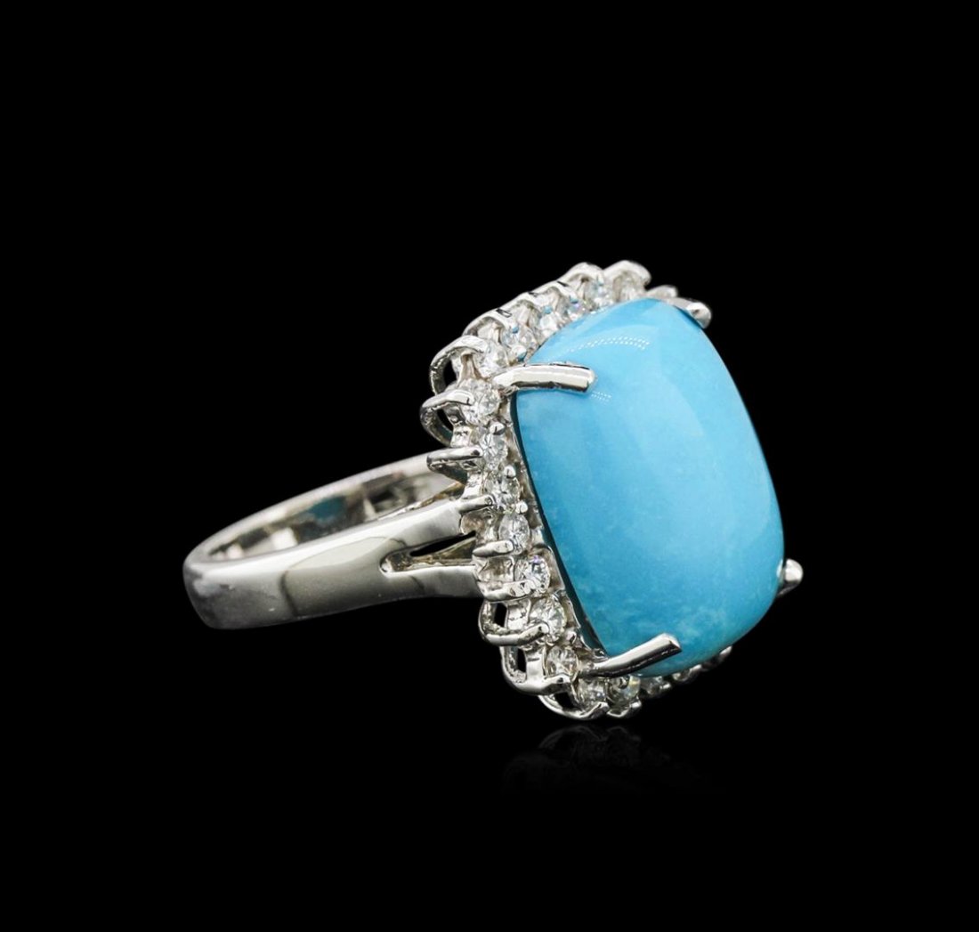 14KT White Gold 8.79 ctw Turquoise and Diamond Ring: One electronically tested 14KT white gold ladies cast turquoise and diamond ring with a bright polish finish. Identified with markings of "14K". Condition is new. Containing: One prong set rectangular