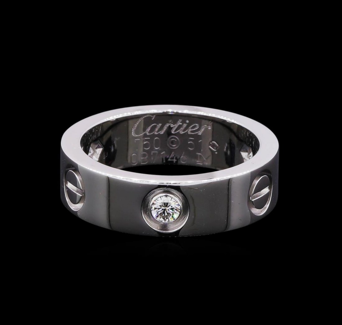 Cartier 18KT White Gold 3 Diamond Love Ring: One Cartier Love ring featuring 18KT white gold containing three diamonds. The ring is stamped Cartier. Size 6. Comes with red Cartier pouch.
