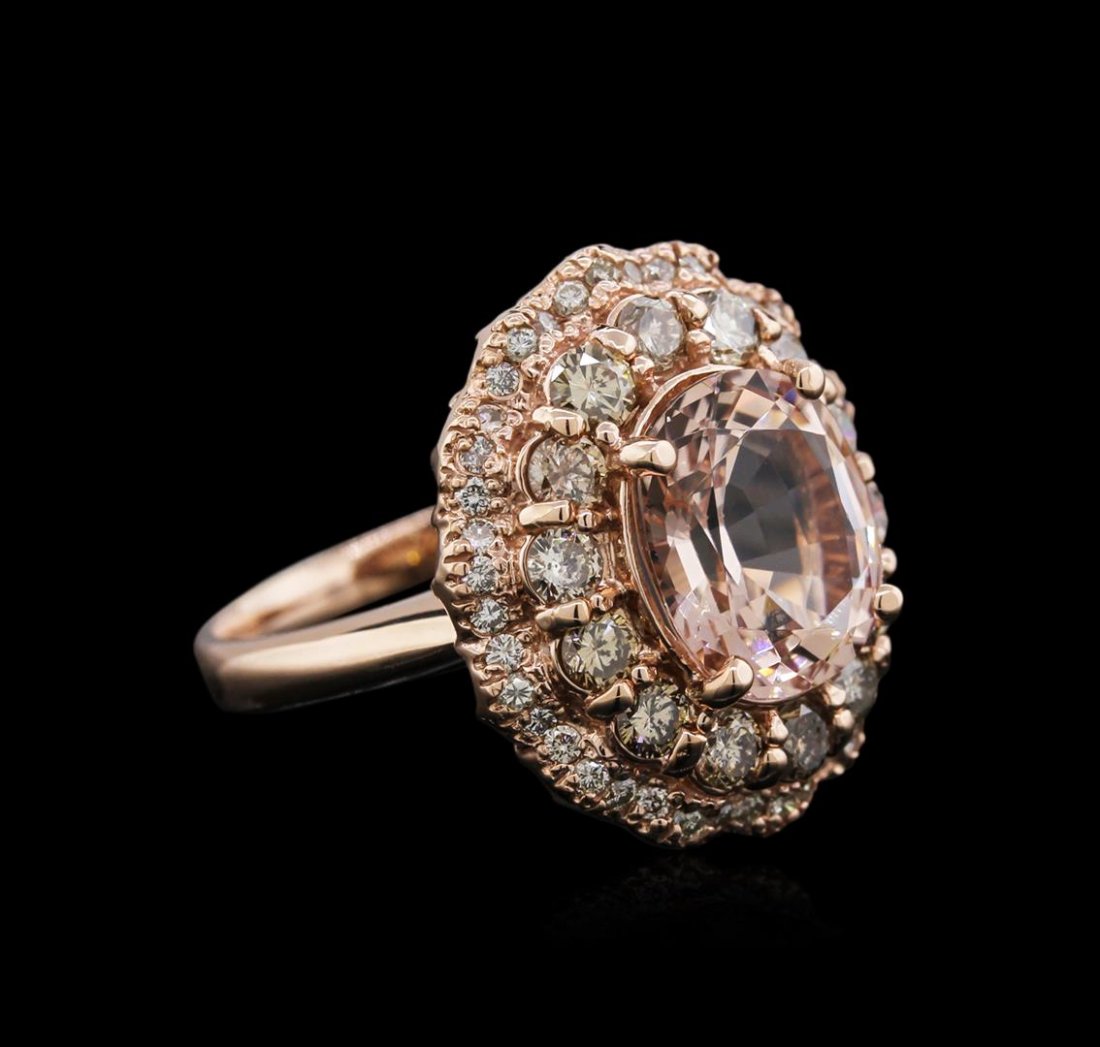 14KT Rose Gold 3.13 ctw Morganite and Diamond Ring: One electronically tested 14KT rose gold ladies cast morganite and diamond ring with a bright polish finish. Identified with markings of "K14". Condition is new. Containing: One prong set oval modifie