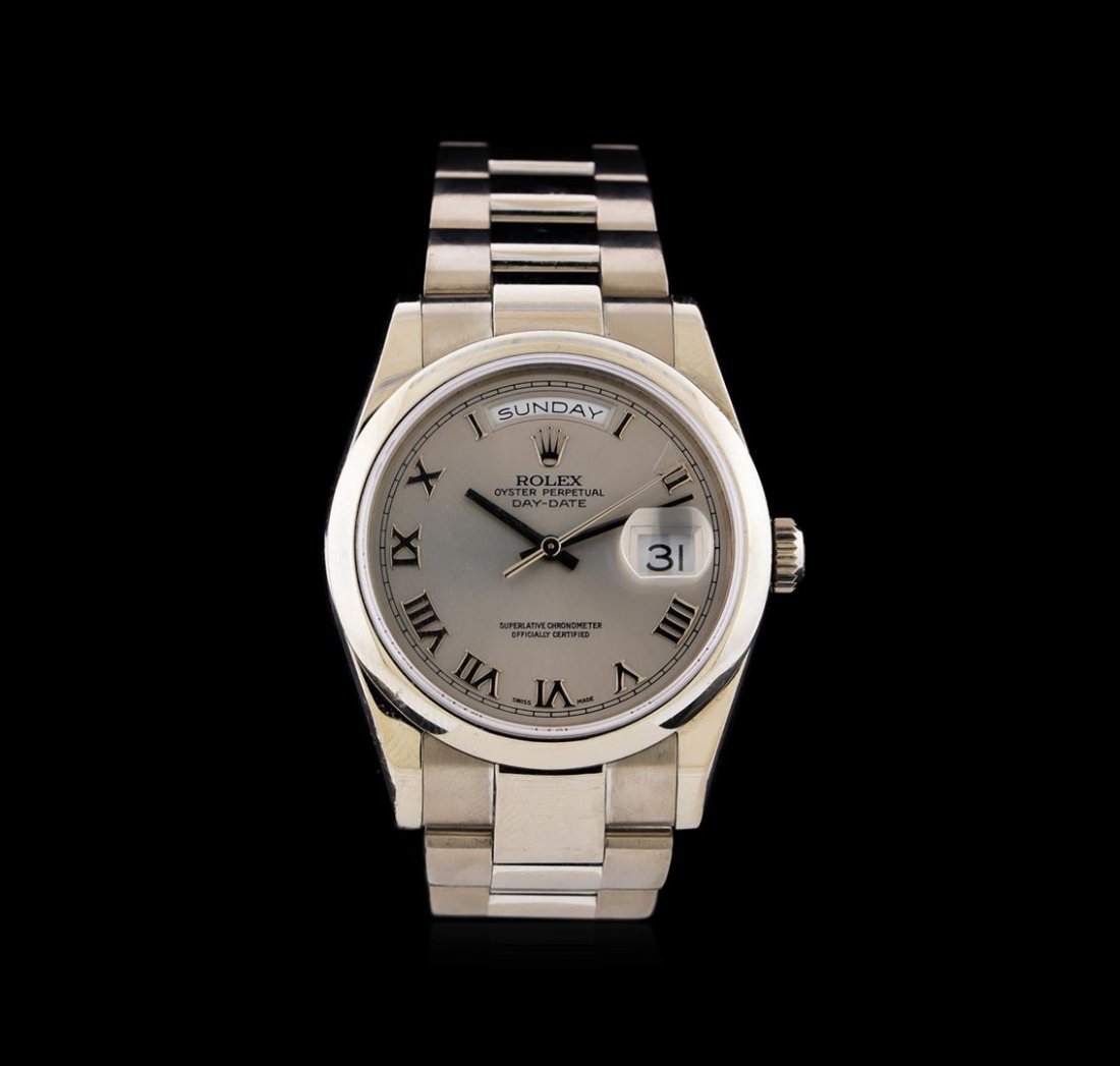 Rolex 18KT White Gold President Day-Date Watch: One Rolex President DayDate watch featuring: Case: 18KT white gold. Bezel: 18KT white gold. Crystal: Sapphire. Crown: Waterproof screw-down. Dial: White color; roman numeral hour markers. Features: Da