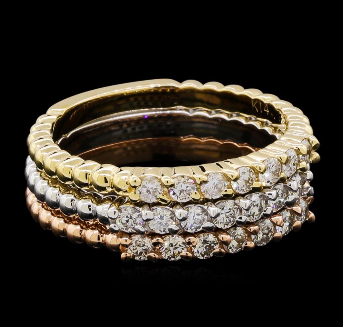 0.65 ctw Diamond Ring Set - 14KT Tri Color Gold: One set of three stackable rings featuring: 14KT yellow, white, and rose gold weighing 6.78 grams containing diamonds with a total weight of 0.65ct.