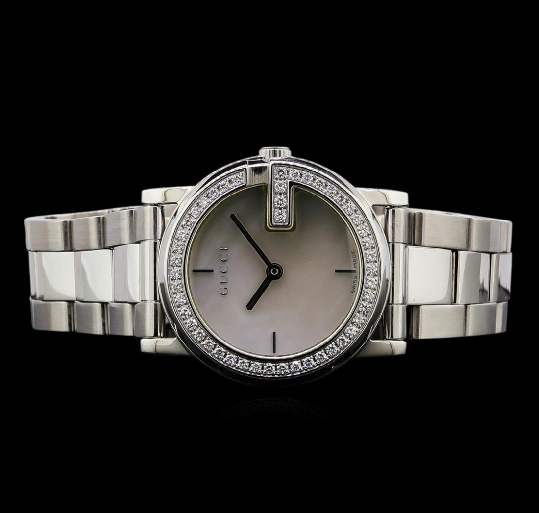 Gucci Stainless Steel Diamond Ladies Watch: One Gucci G Factory ladies watch featuring: Case: stainless steel. Bezel: stainless steel set with diamonds. Dial: Mother of pearl; silver tone index hour markers ; silver tone hour and minute hands. 