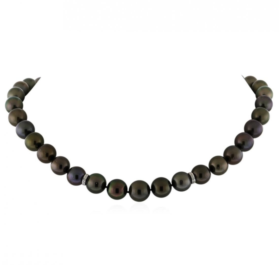 Tahitian Cultured Pearl Necklace With Diamond Clasp: One graduated single strand pearl necklace 17.5" princess length, knotted with a tongue clasp containing 37 Tahitian pearls, 10.0mm in size to 12.4mm in size. The pearls are black in color, green over