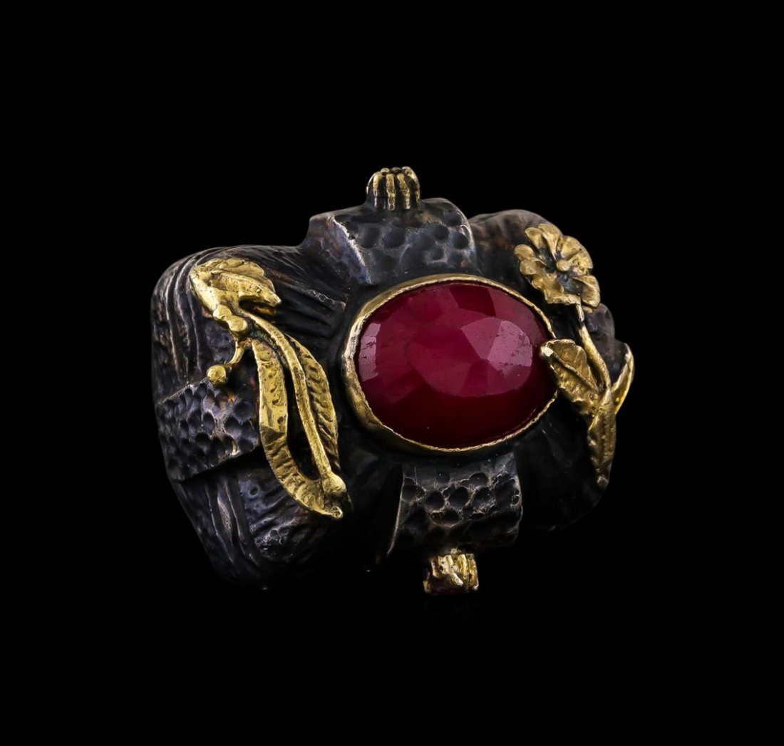 Sterling Silver Ring: One of a kind high fashion sterling silver Ring weighing 29.6 grams. Black Antique texture. Containing: Ruby. This sterling silver promises a lasting shine.