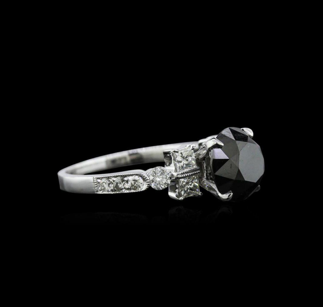 3.51 ctw Black Diamond Ring - 18KT White Gold: One electronically tested 18KT white gold ladies cast diamond engagement ring with a bright polish finish. Identified with markings of "18K". Condition is new. Containing: One prong set round brillian