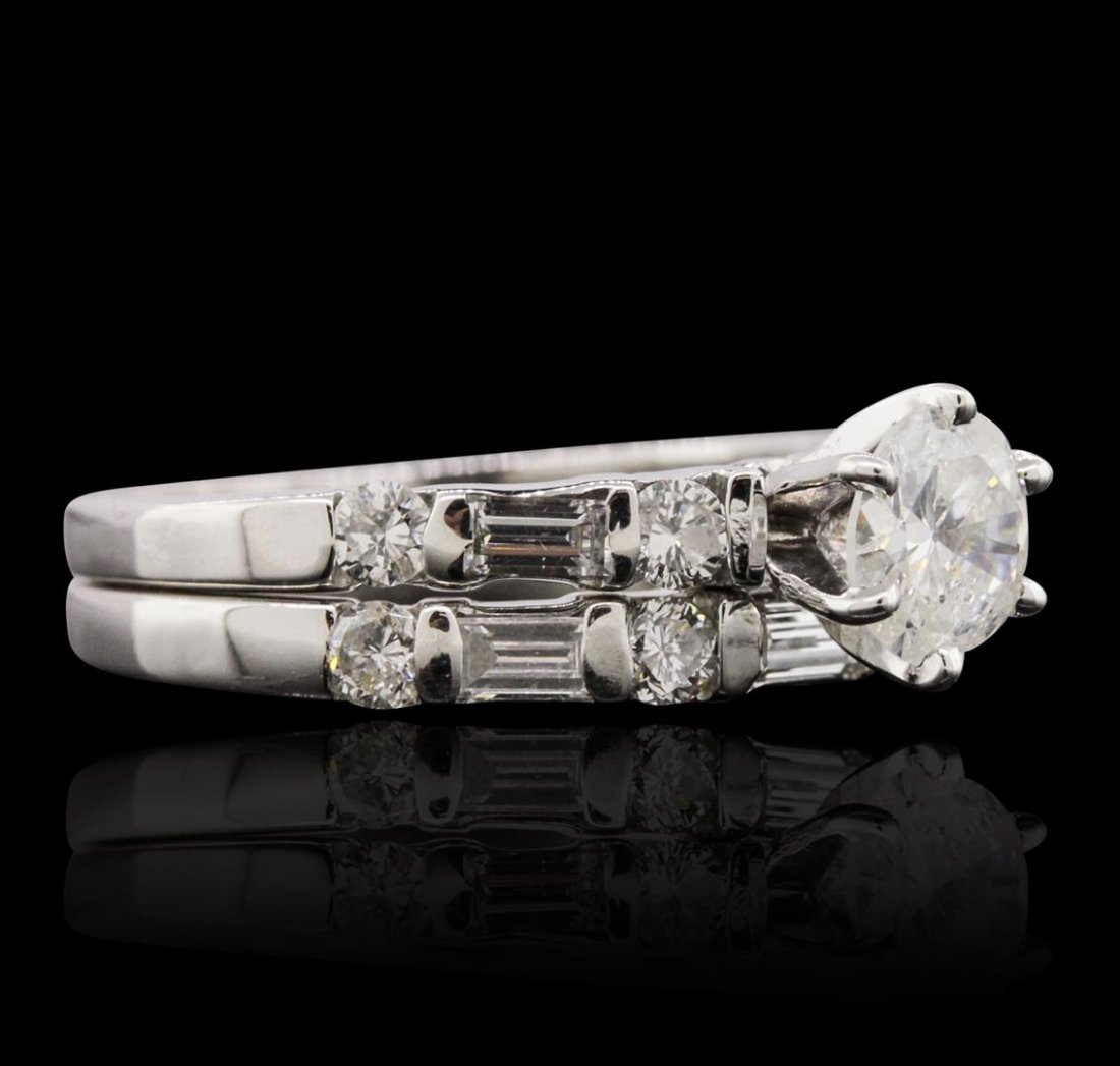 14KT White Gold 1.33 ctw Diamond Ring Wedding Set: One electronically tested 14KT white gold Ladies combination cast & assembled engagement ring & wedding band with a bright polish finish. Condition is very good. Identified with markings of "14K". Con