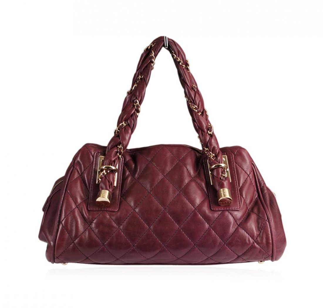 Chanel Purple Handbag: One Chanel Purple Handbag. This authentic roomy tote epitomizes everyday sophistication and makes a perfect everyday bag, large enough to hold all your essentials in style. The leather handbag measure