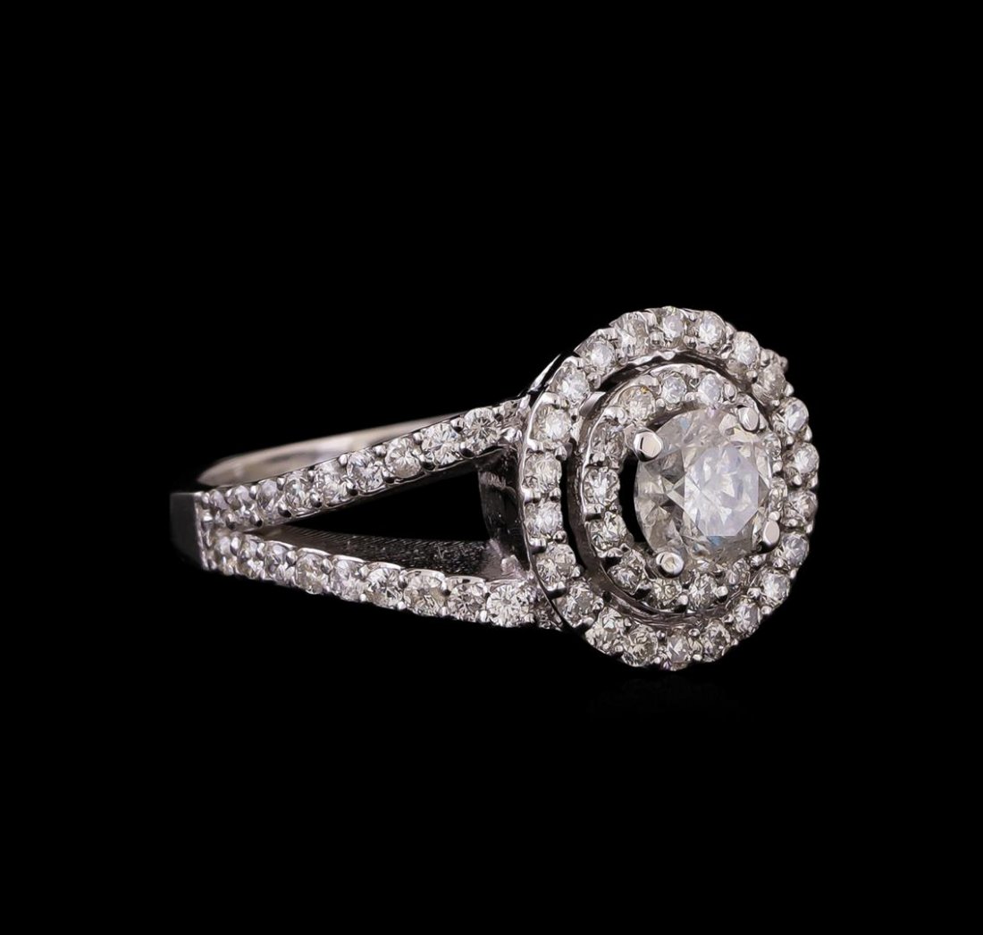 14KT White Gold 1.12 ctw Diamond Ring: One electronically tested 14KT white gold ladies cast diamond engagement ring with a bright polish finish. Identified with markings of "K14". Condition is new. Containing: One prong set round brillian