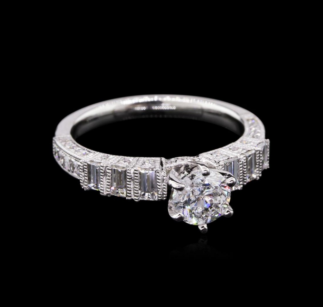1.53 ctw Diamond Ring - 18KT White Gold: One electronically tested 18KT white gold lady's combination cast & assembled tapered wedding ring with a bright polish with milgrain detailing finish. The featured lady's ring has a shank measuring 2