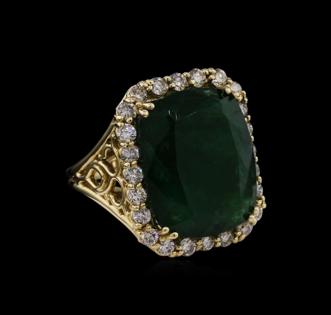 14KT Yellow Gold 15.27 ctw Emerald and Diamond Ring: One electronically tested 14KT yellow gold ladies cast emerald and diamond ring with a bright polish finish. Condition is new, good workmanship. The featured emerald is set within a diamond bezel, sup