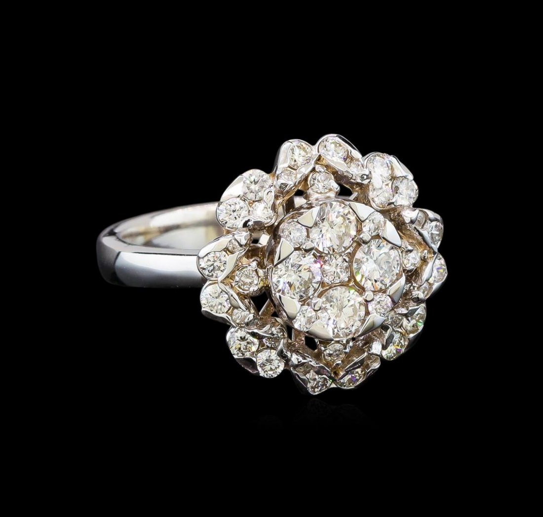 14KT White Gold 1.00 ctw Diamond Ring: One electronically tested 14KT white gold ladies cast diamond ring with a bright polish finish. Identified with markings of "14K". Condition is new. Containing: Four prong set round brilliant cut diam