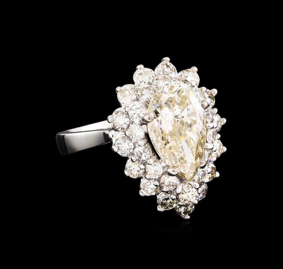 14KT White Gold 4.69 ctw Diamond Ring: One electronically tested 14KT white gold ladies cast diamond ring with a bright polish finish. Condition is new, good workmanship. The featured diamond is set within a two tiered diamond bezel suppor