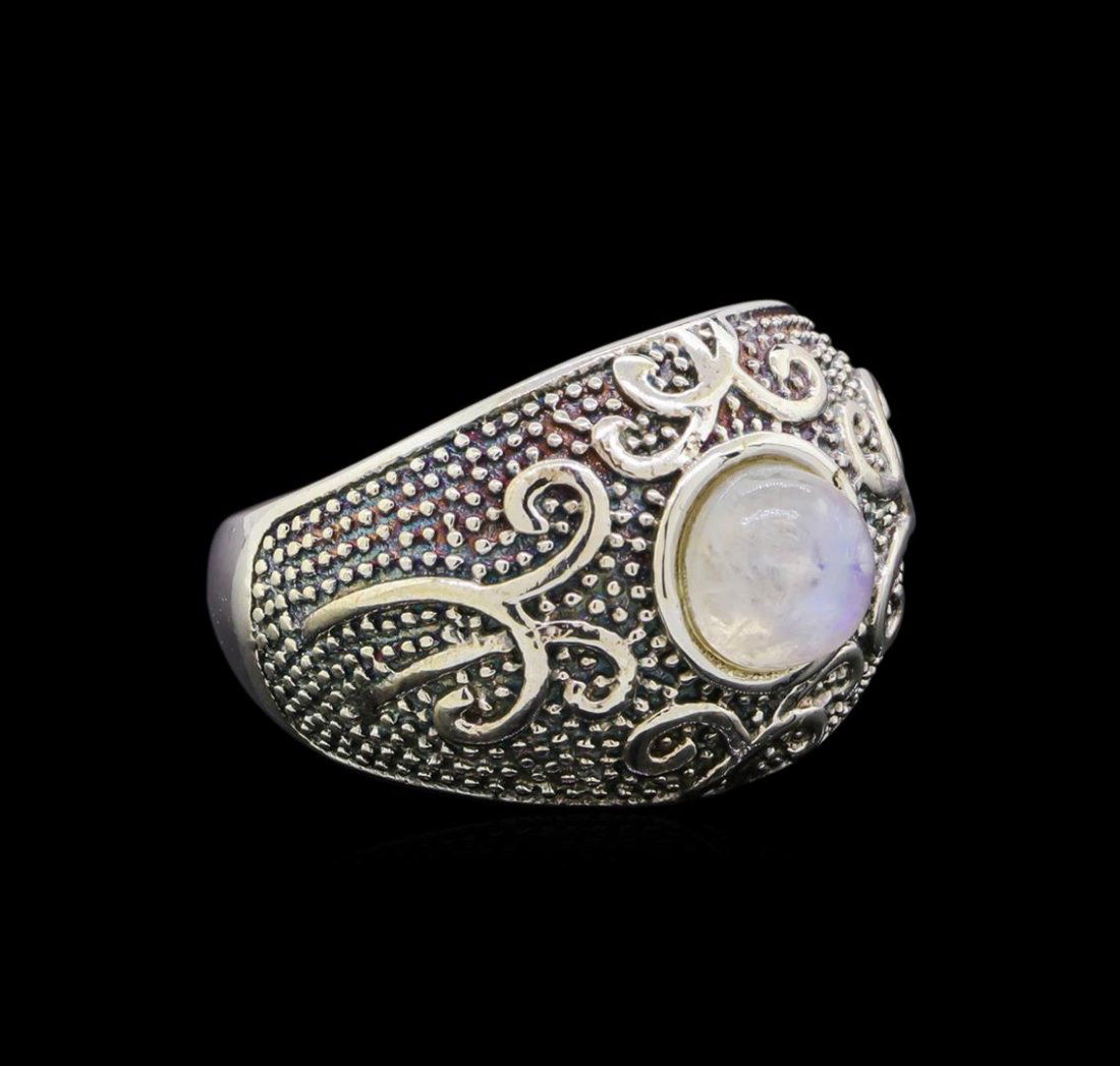 Sterling Silver Ring: One of a kind high fashion sterling silver Ring weighing 10 grams. Containing: Moonstone. This sterling silver promises a lasting shine.