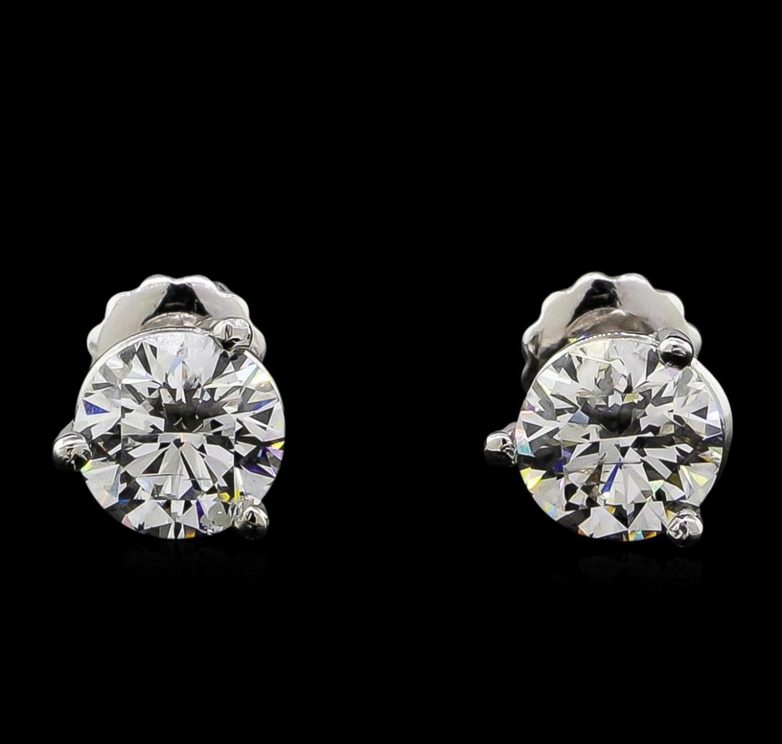 2.02 ctw Diamond Solitaire Earrings - Platinum: One pair electronically tested platinum cast & assembled diamond solitaire earrings with screw backs. Bright polish finish. Condition is new, good workmanship. Containing: One prong set round brillian