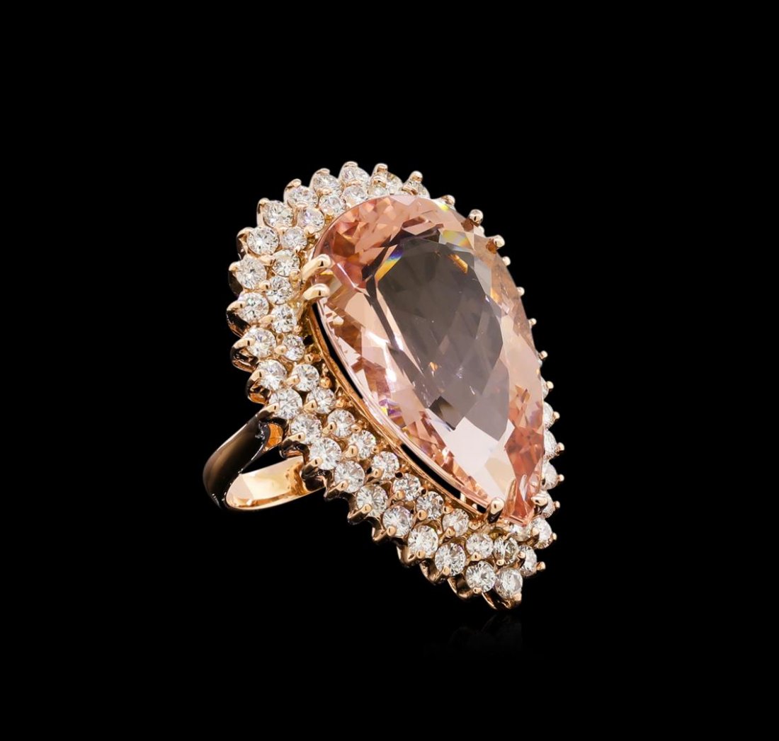 22.88 ctw Morganite and Diamond Ring - 14KT Rose Gold: One electronically tested 14KT rose gold lady's cast fashion ring with a double basket halo with a bright polish finish. The featured lady's ring has a shank measuring 3.20 millimeters wide. Identifie