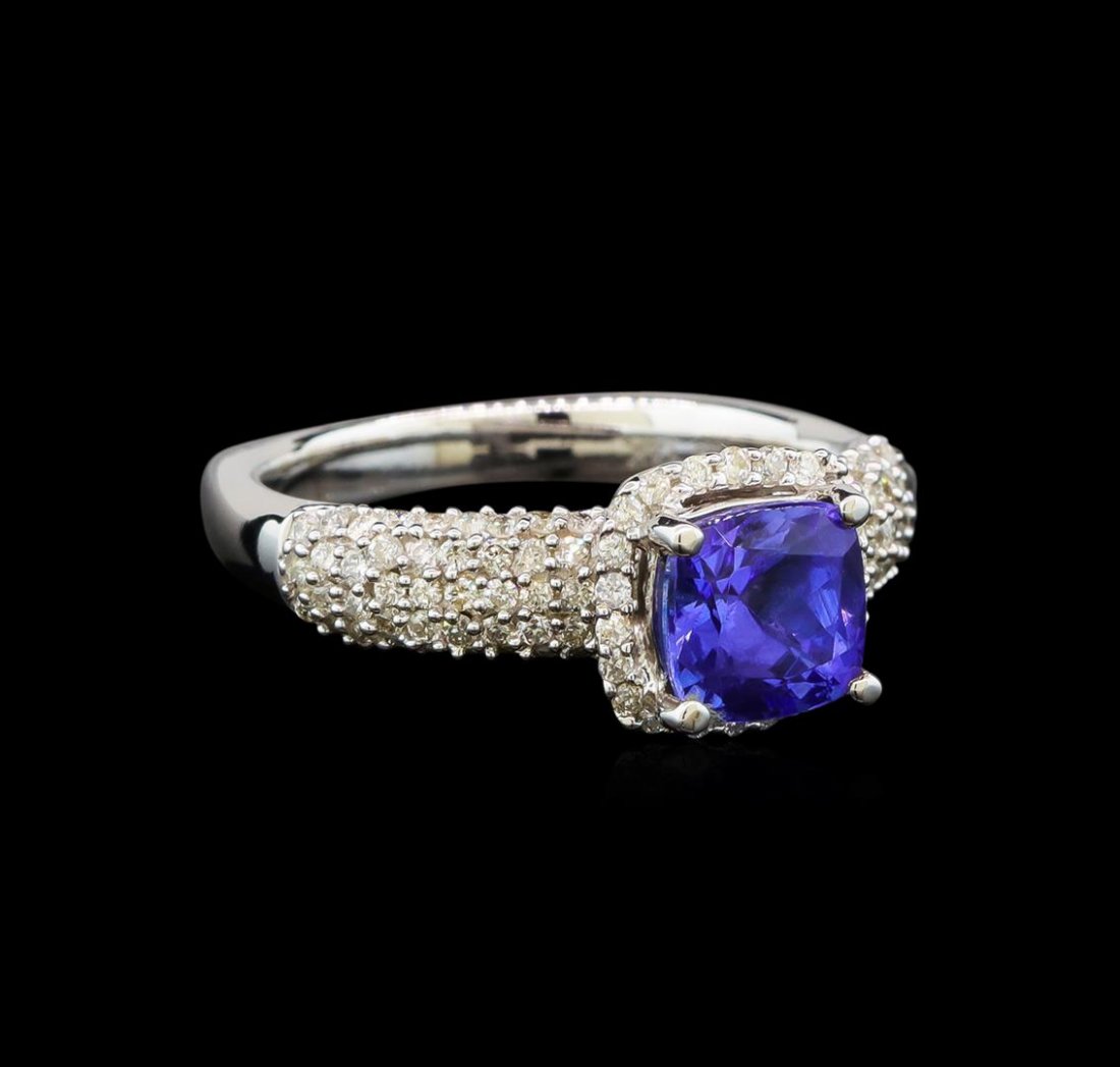 14KT White Gold 1.41 ctw Tanzanite and Diamond Ring: One electronically tested 14KT white gold ladies cast tanzanite and diamond ring with a bright polish finish. Identified with markings of "14K". Condition is new. Containing: One prong set square cush