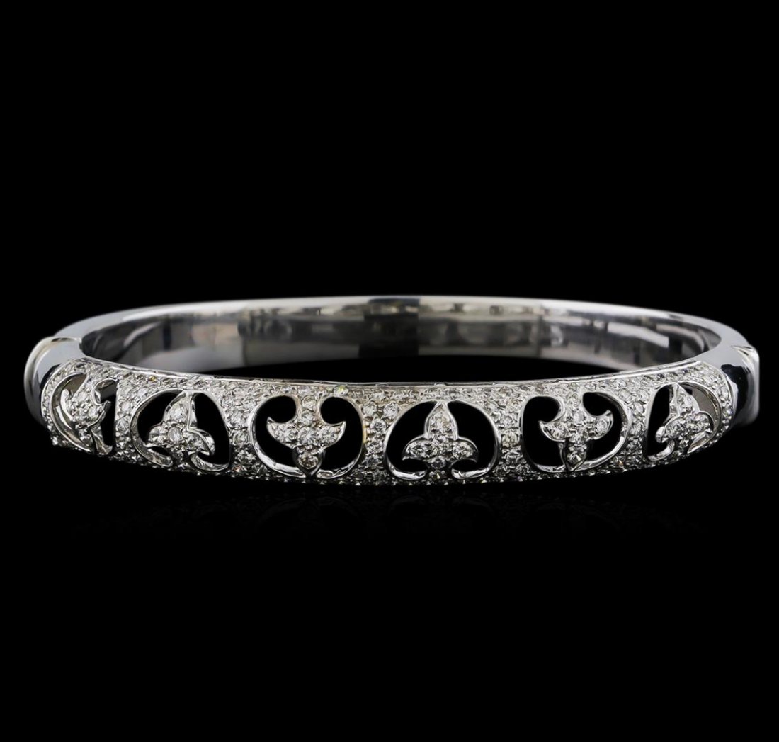 18KT White Gold 1.67 ctw Diamond Bangle Bracelet: One electronically tested 18KT white gold ladies cast bangle bracelet with a bright polish finish. Measurements: 2.5" x 2.2". Condition is new. Containing: One Hundred Sixty-Seven prong set round bril