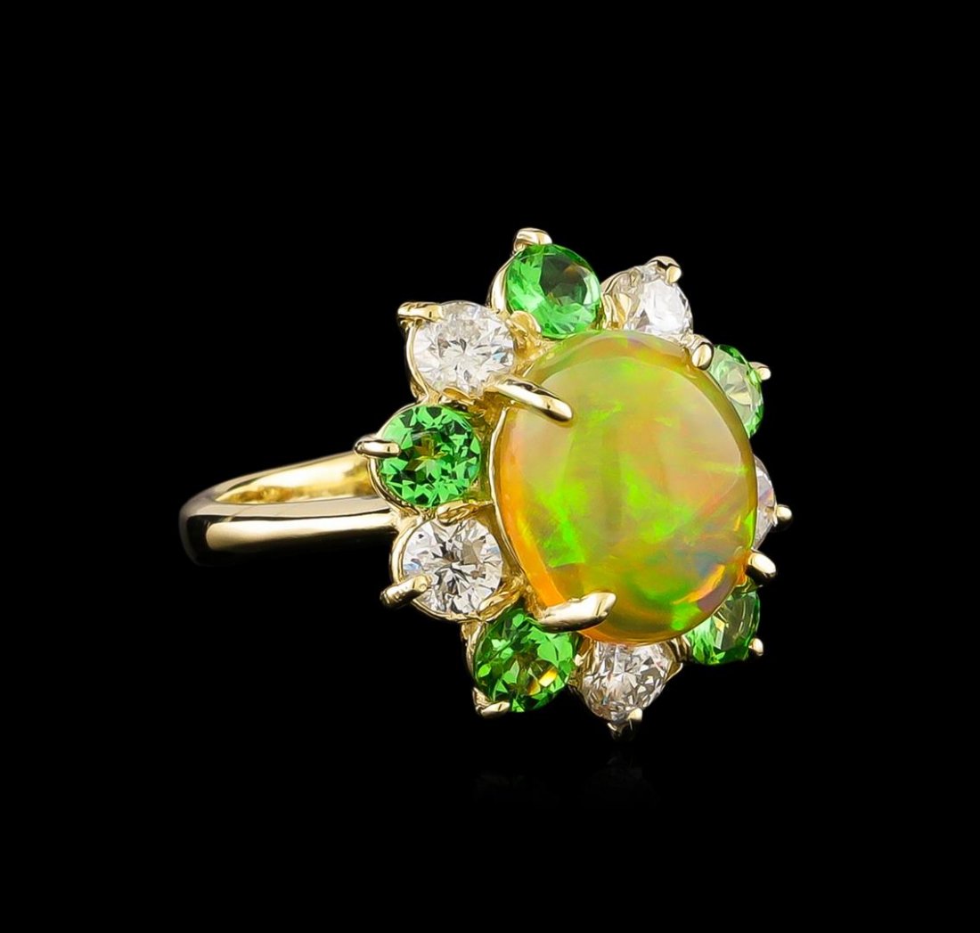 2.48 ctw Opal, Tsavorite and Diamond Ring - 14KT Yellow: One ring featuring: 14KT yellow gold weighing 4.73 grams containing one opal center stone with a total weight of 2.48ct, tsavorites with a total weight of 0.98ct, and diamonds with a total weight of 0