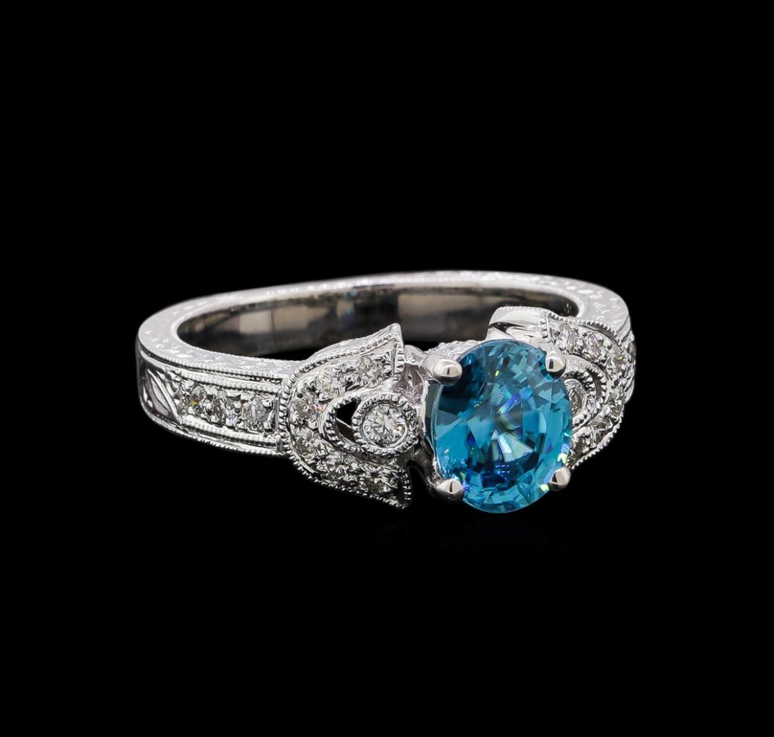 2.11 ctw Blue Zircon Ring - 18KT White Gold: One ring : 18KT yellow gold weighing 6.6gm containing one blue zircon with a total weight of 2.11ct and diamonds weighing 0.32ctw.