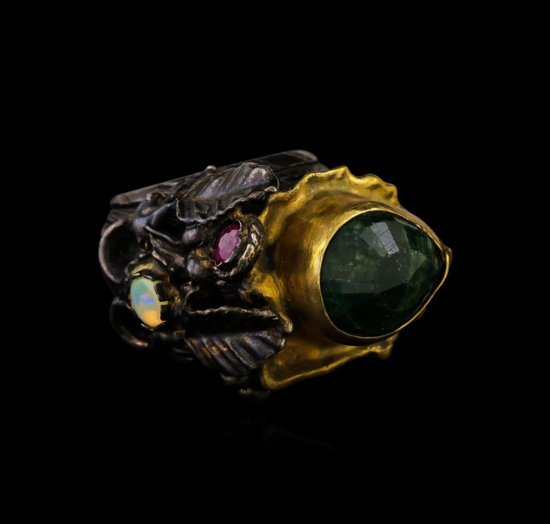 Sterling Silver Ring: One of a kind high fashion sterling silver Ring weighing 24.8 grams. Black Antique texture. Containing: Green Corundum, Created Ruby, Created Opal. This sterling silver promises a lasting shine.