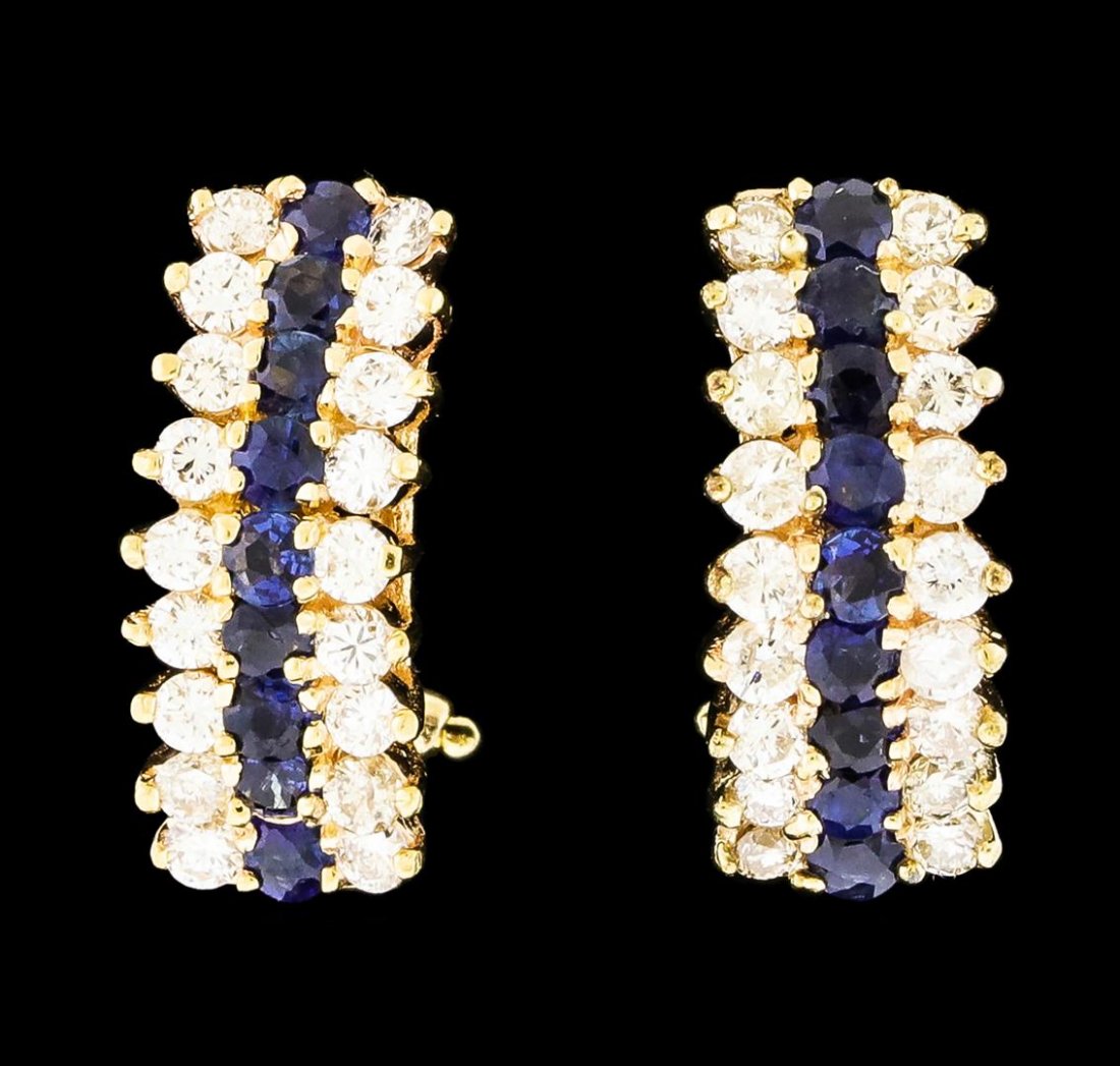 1.00 ctw Sapphire and Diamond Earrings - 14KT Yellow: One pair electronically tested 14KT yellow gold lady's combination cast & assembled fashion earrings with Omega clip backs with posts with a bright polish finish. Identified with markings of '14K'. Co