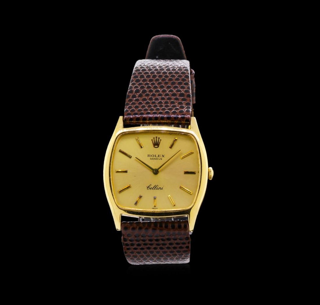 Rolex 18KT Yellow Gold Cellini Watch: One Rolex Cellini watch featuring: Case: 18KT yellow gold. Dial: gold color; gold tone hour and minute hands; gold tone hour markers. Bracelet: Genuine brown leather strap with buckle clasp.