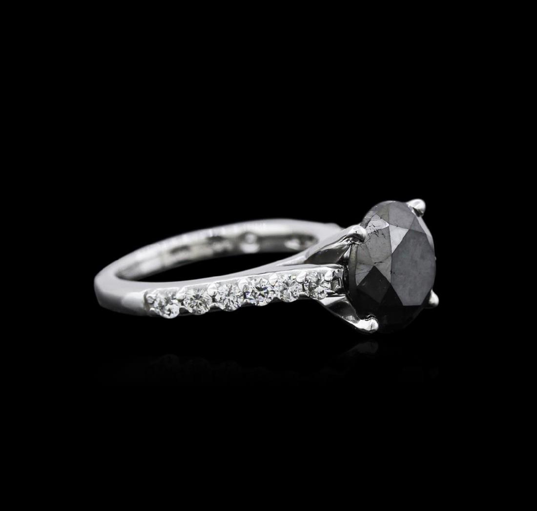 4.02 ctw Black Diamond Ring - 14KT White Gold: One electronically tested 14KT white gold ladies cast diamond engagement ring with a bright polish finish. Identified with markings of "14K". Condition is new. Containing: One prong set round brillian