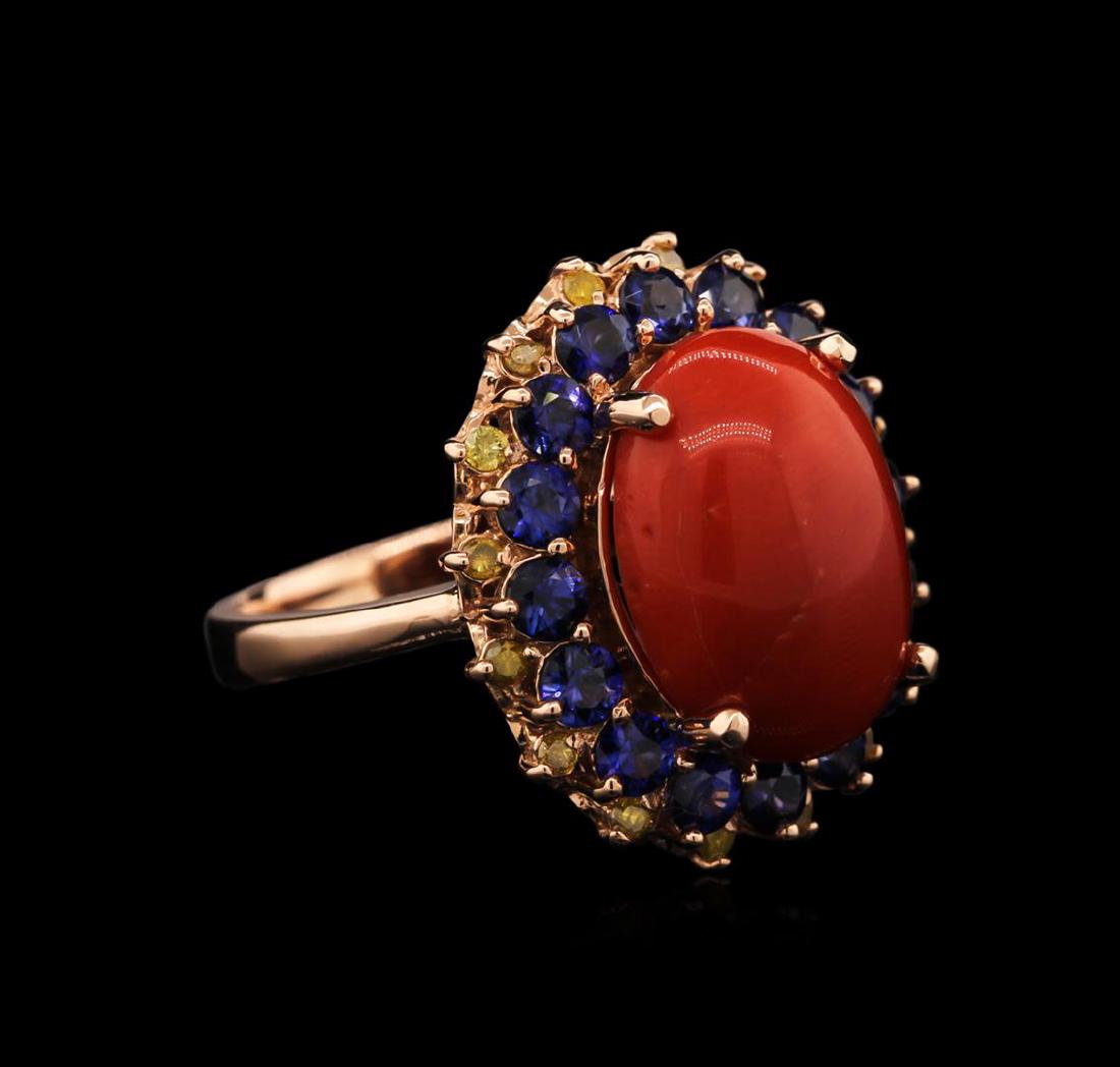 5.85 ctw Coral, Sapphire and Yellow Diamond Ring - 14KT: One ring featuring: 14KT rose gold weighing 7.08 grams containing one coral center stone with a total weight of 5.85ct, 16 blue sapphires with a total weight of 1.75ct, and 16 yellow diamonds with a t