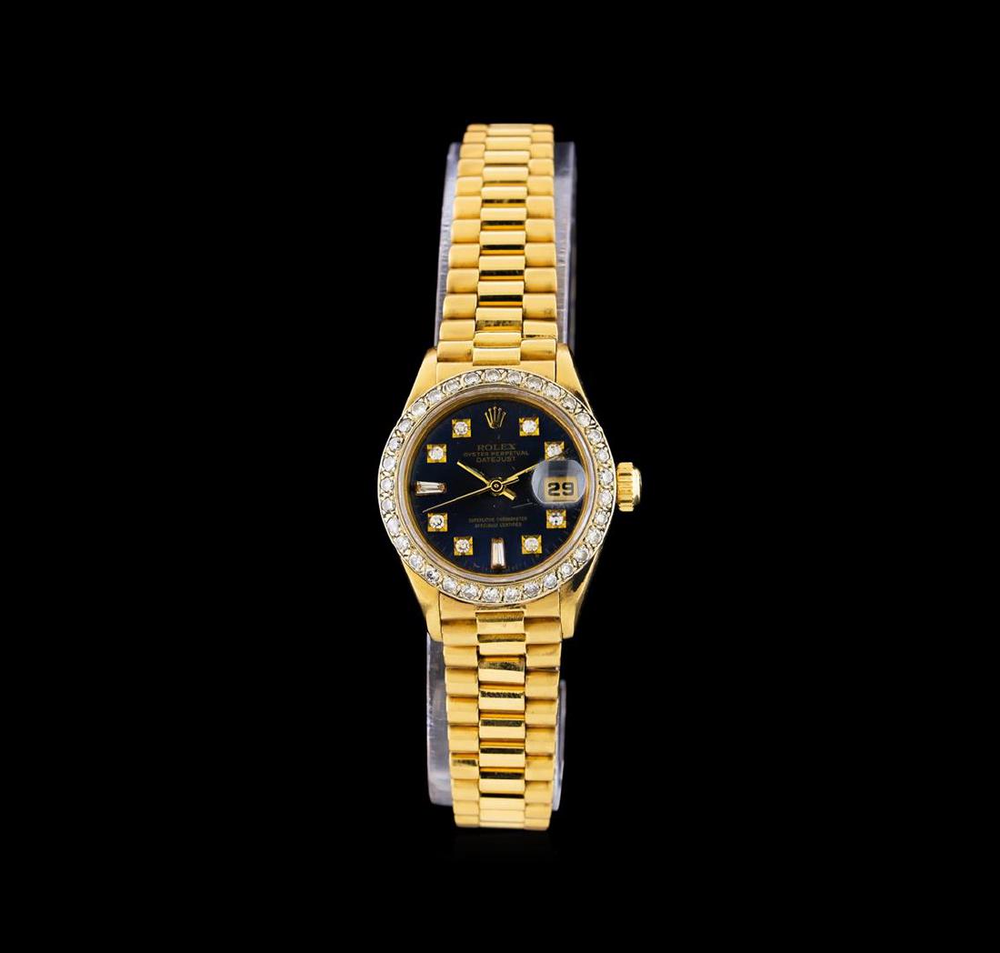 Rolex 18KT Gold Diamond DateJust Ladies Watch: One Rolex DateJust ladies watch featuring: Case: 18KT yellow gold. Bezel: Diamond set yellow gold. Crystal: Scratch-resistant sapphire. Dial: Deep blue color; diamond hour markers. Features: Date wind