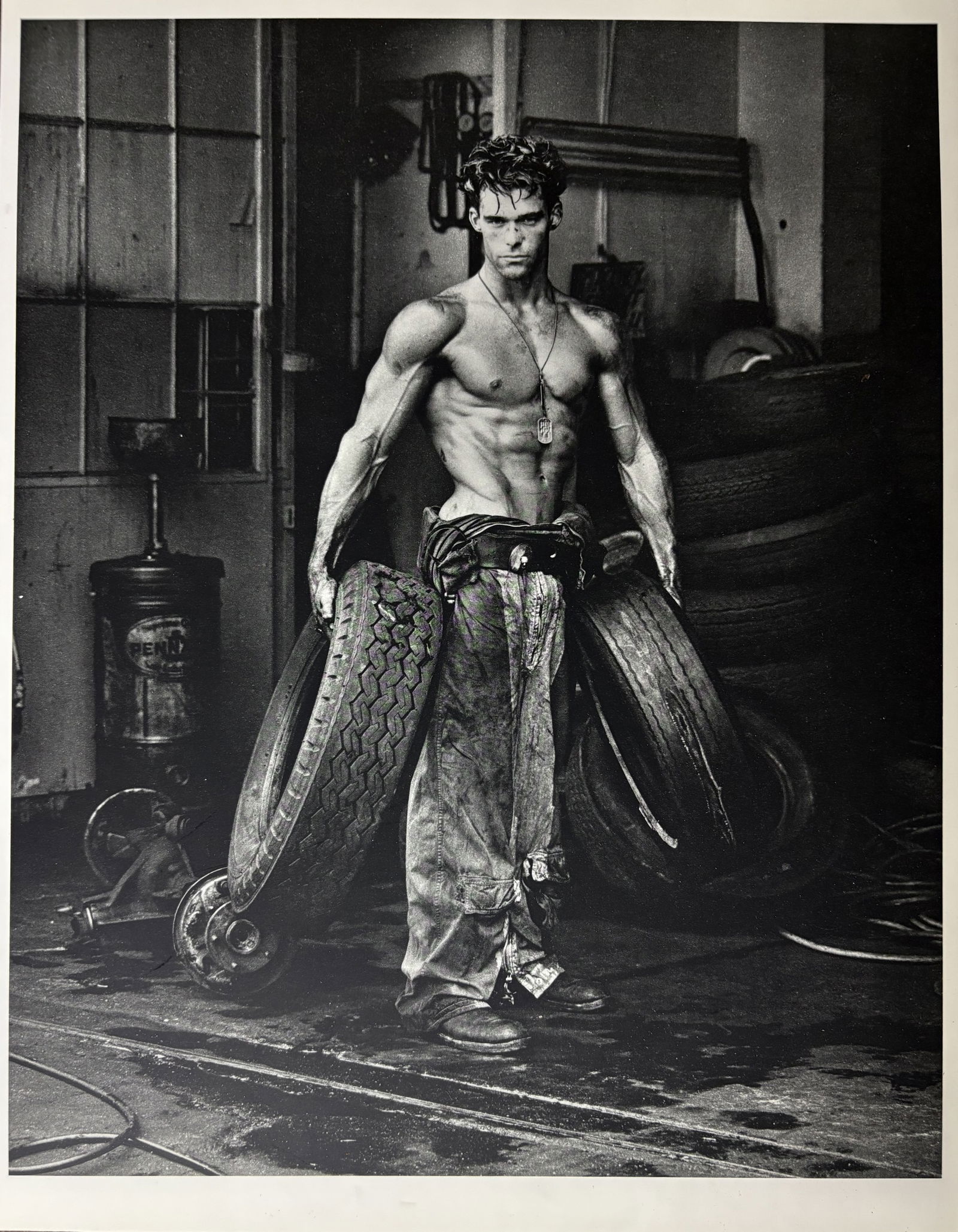 HERB RITTS MAN WITH TIRES PHOTOGRAVURE (1 of 2)