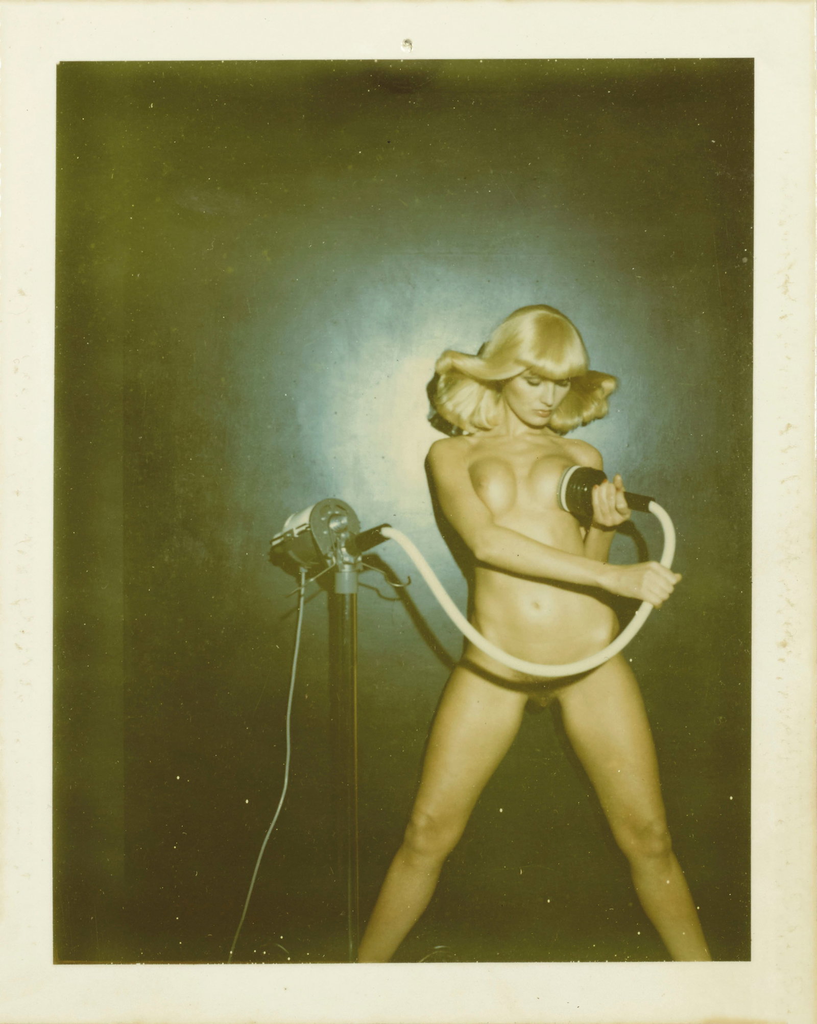 HELMUT NEWTON PLAY BOY PRINT: Helmut Newton Playboy Print mounted to conservation board measuring at 4.5x5.5 inches. Printed later.