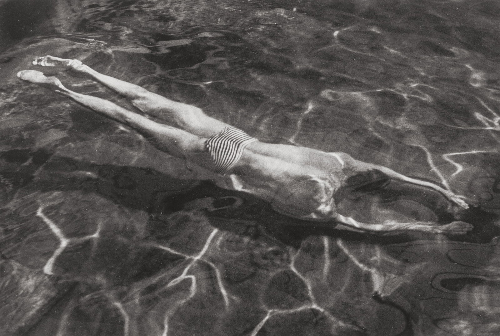 ANDRE KERTESZ UNDERWATER SWIMMER PRINT: Andre Kertesz Underwater Swimmer Print mounted to board measuring at 13.5x19.5 inches. Printed later.