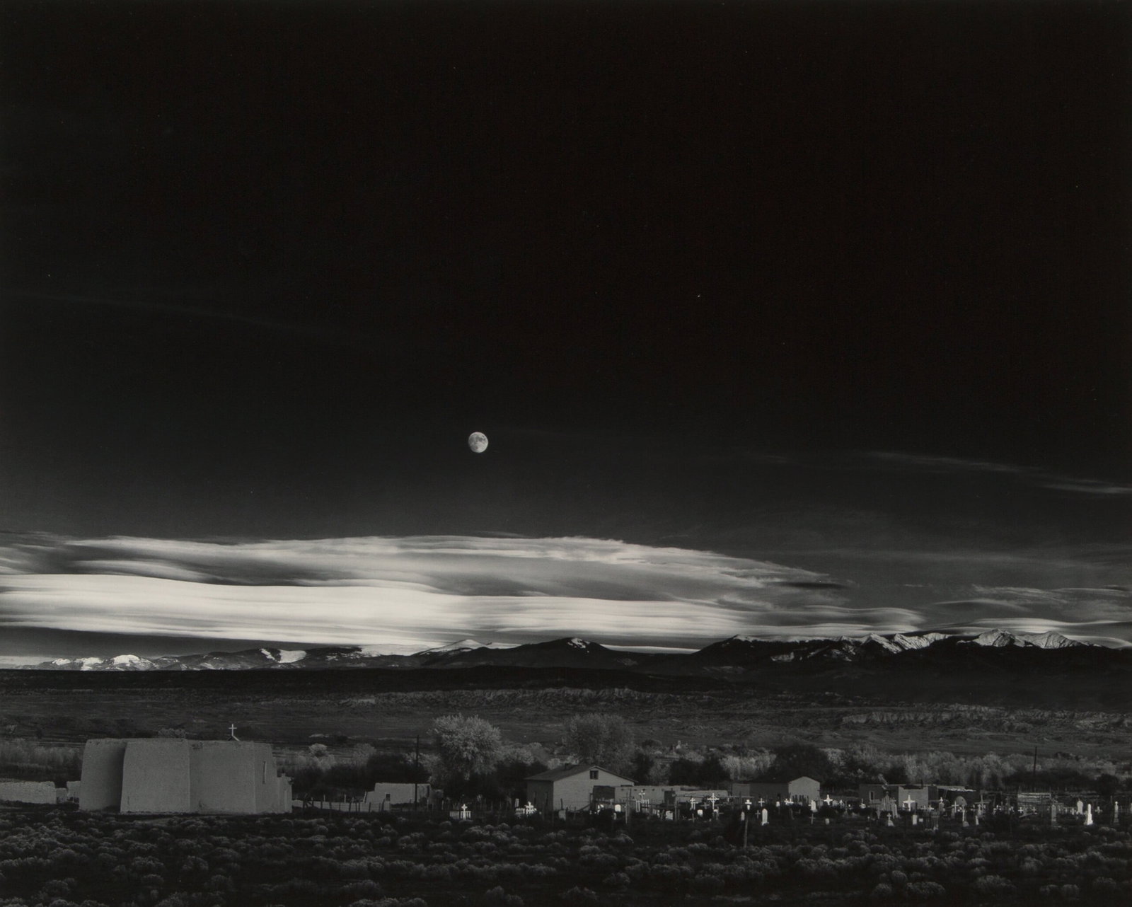 ANSEL ADAMS MOONRISE NEW MEXICO PRINT: Ansel Adams Moonrise New Mexico Print mounted to board measuring at 14.5x18.25 inches. Printed later.