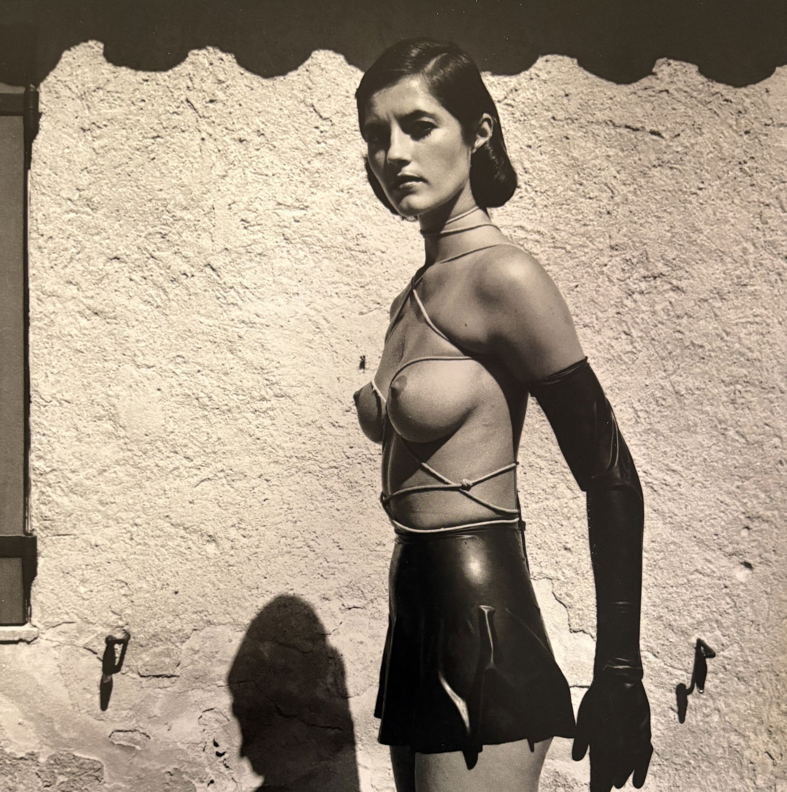 HELMUT NEWTON BONDAGE GIRL DUOTONE PRINT: Helmut Newton Bondage Girl Duotone Print mounted to board measuring at 9.5x9.5 inches.